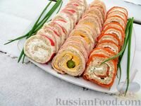 три праздничных рулета (с красной рыбой, ветчиной и крабовыми палочками) фото